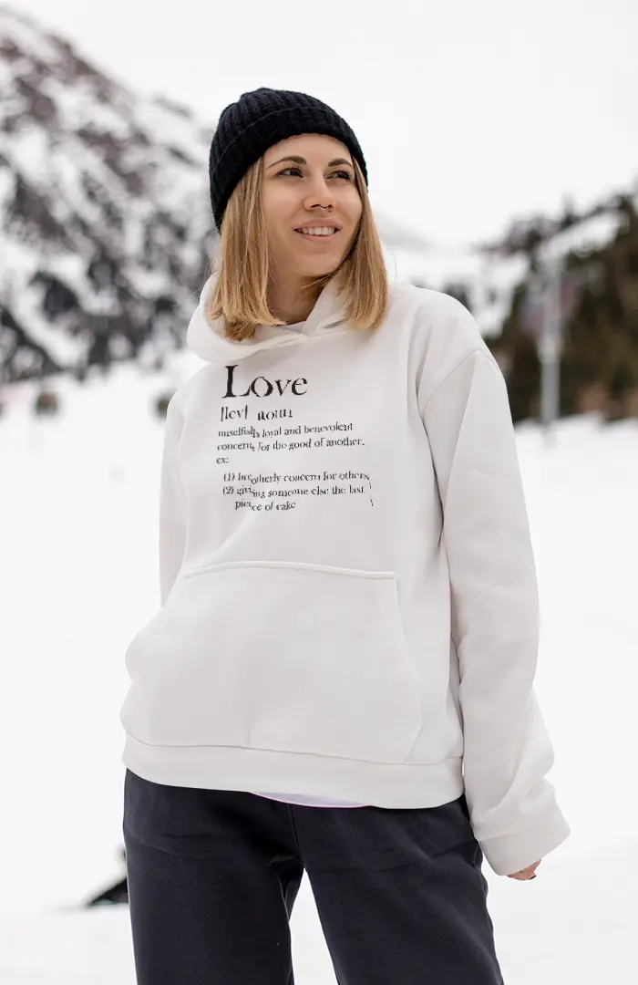 Female wearing a white hoodie in the snow