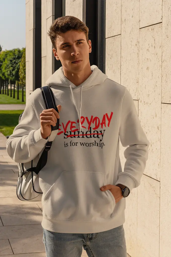 Man wearing a hoodie and carrying a backpack